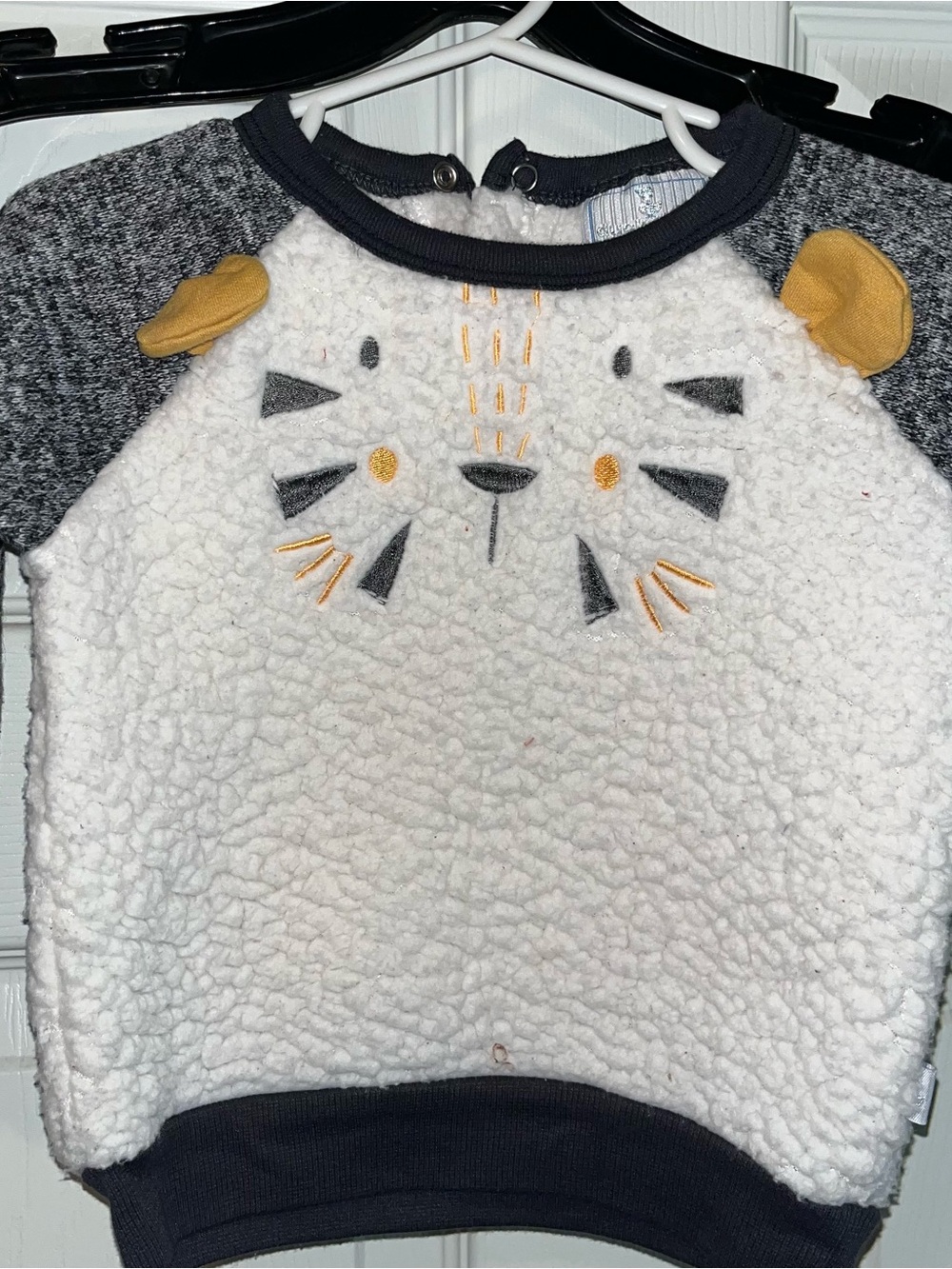 Cozy Cream Sherpa Tiger Sweatshirt with Mustard Accents.